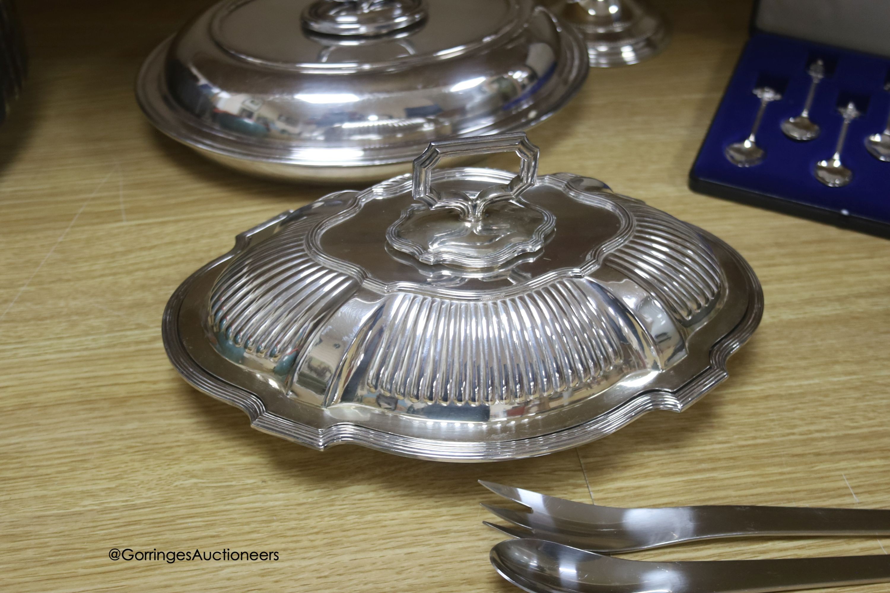 A group of plated ware including a pair of Georg Jensen salad servers